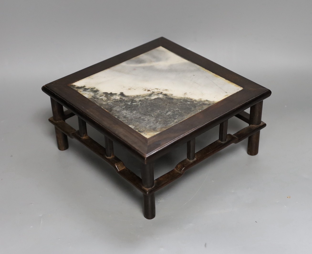 A late 19th century Chinese hongmu and dreamstone marble inset stand, 21cm sq